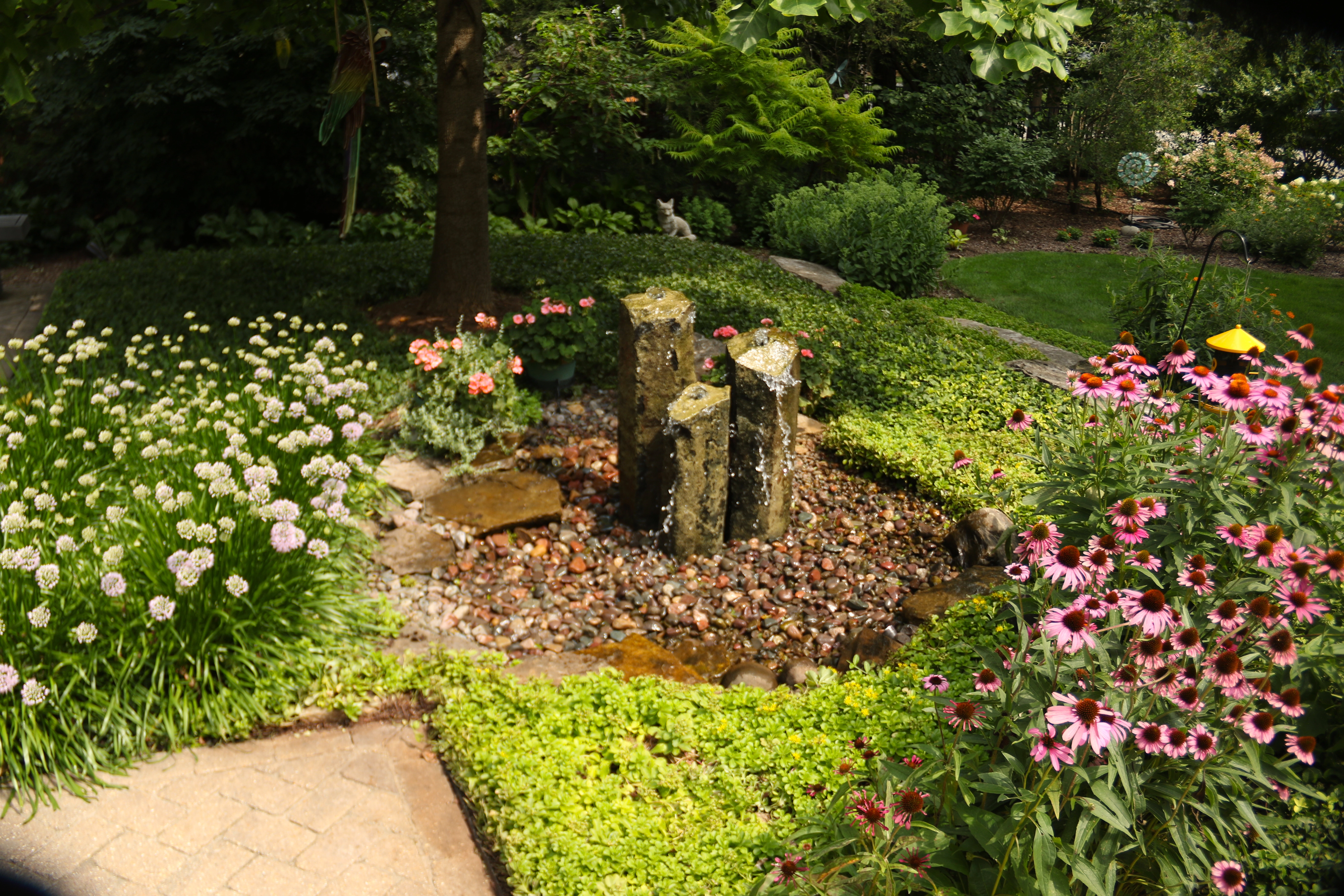 Decorative fountainscape integrated into an established landscape