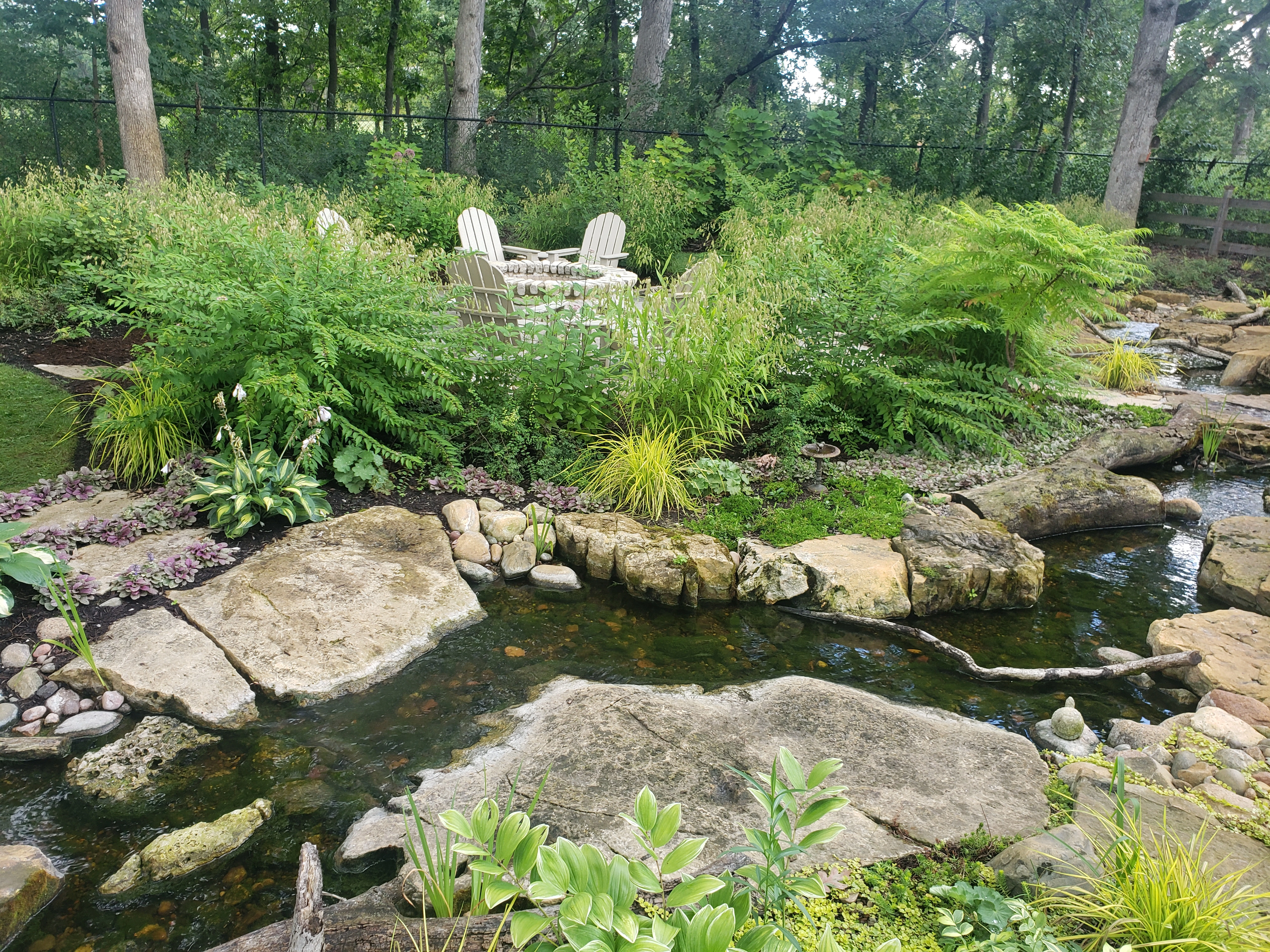 Natural backyard stream and pond feature in Bloomington Minnesota