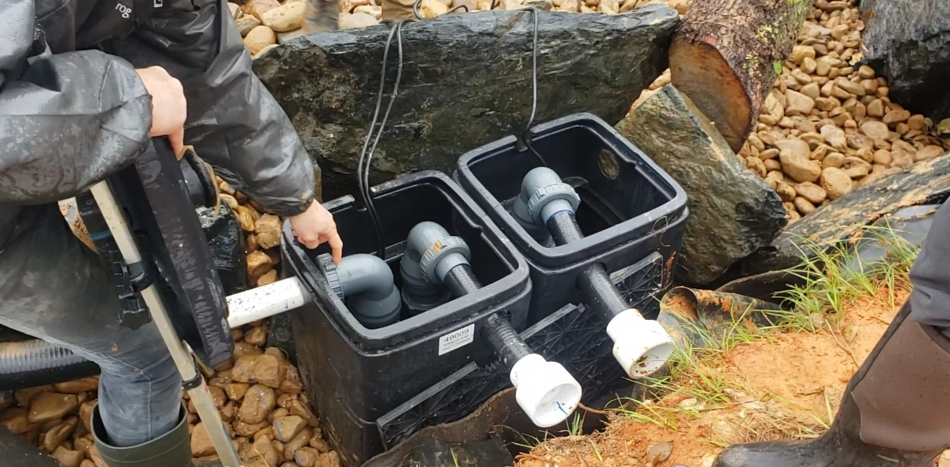 Professional pond pump vault and plumbing system during installation