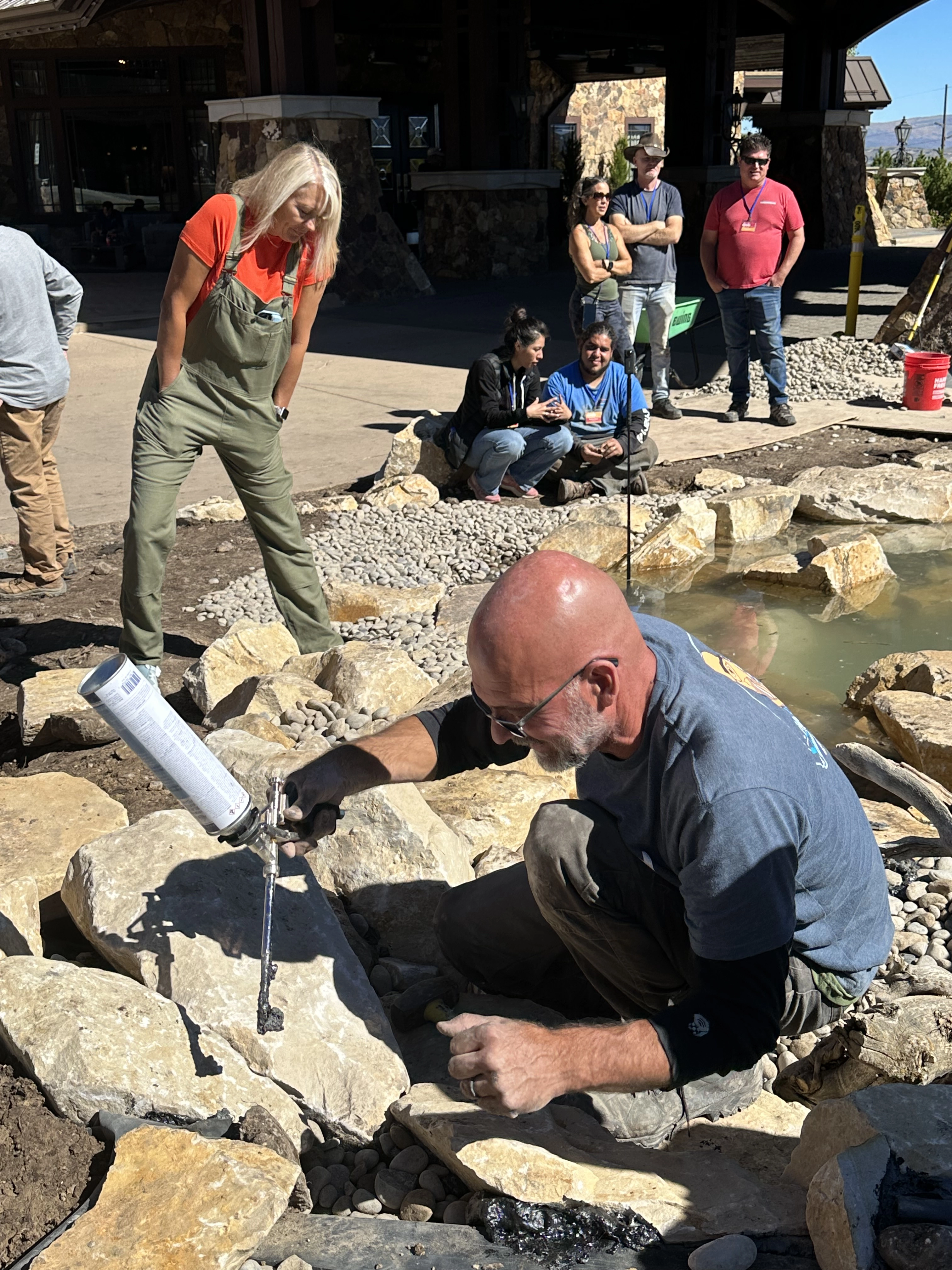 Waterfall foam sealing process during natural stone waterfall construction