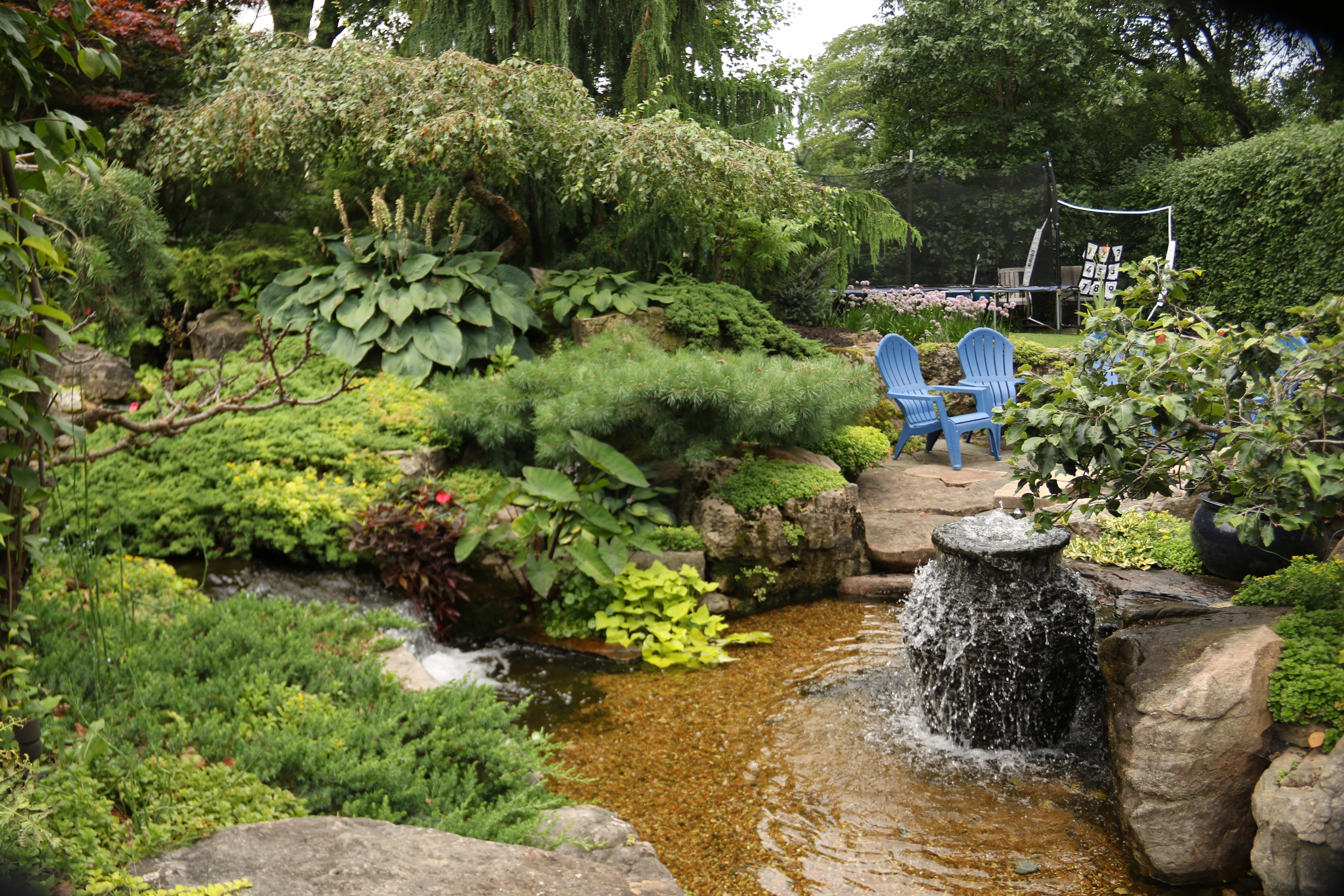 Mature landscape with pond and patio near Deephaven Minnesota