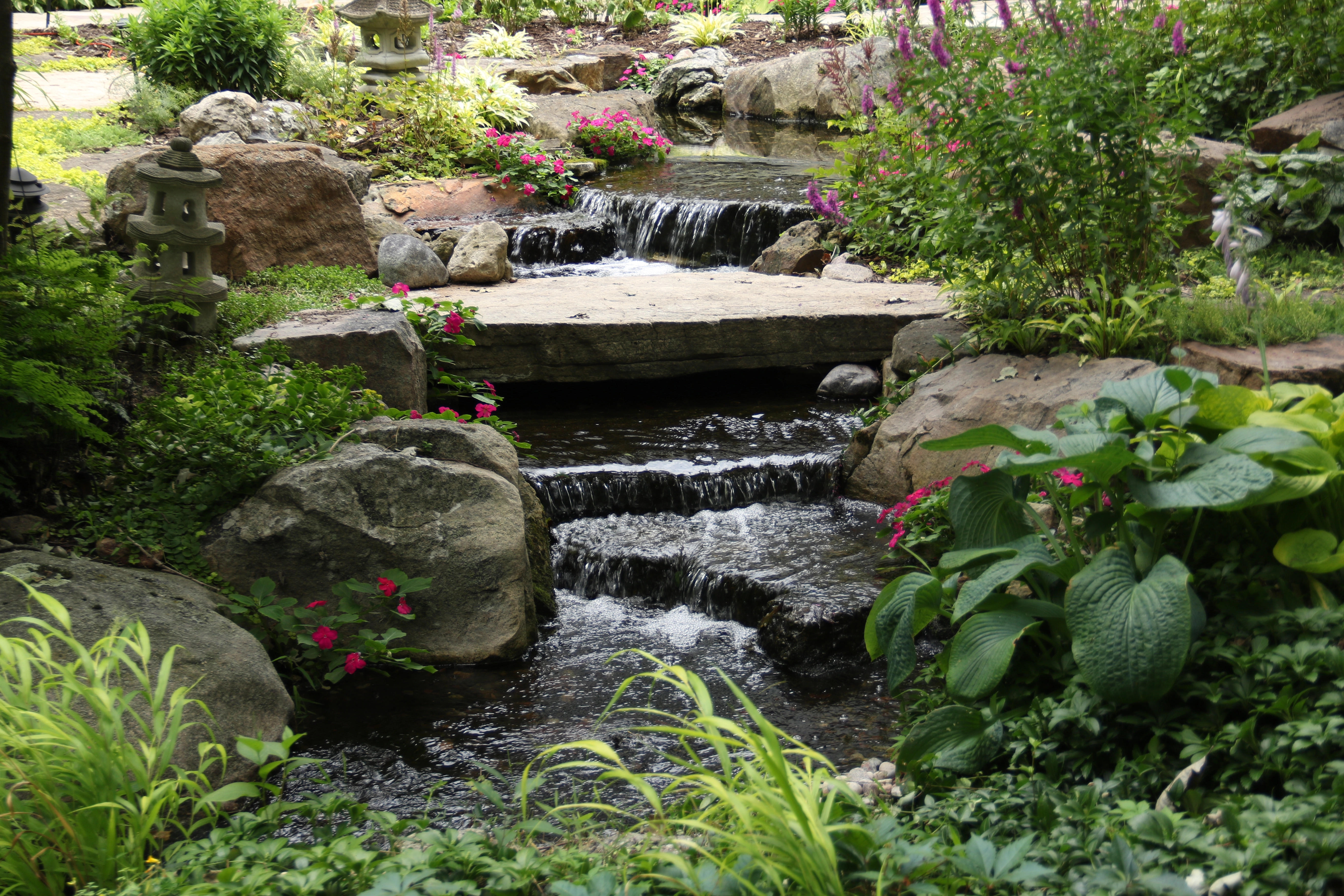 Pondless waterfall stream upgrade with natural stone in Faribault Minnesota