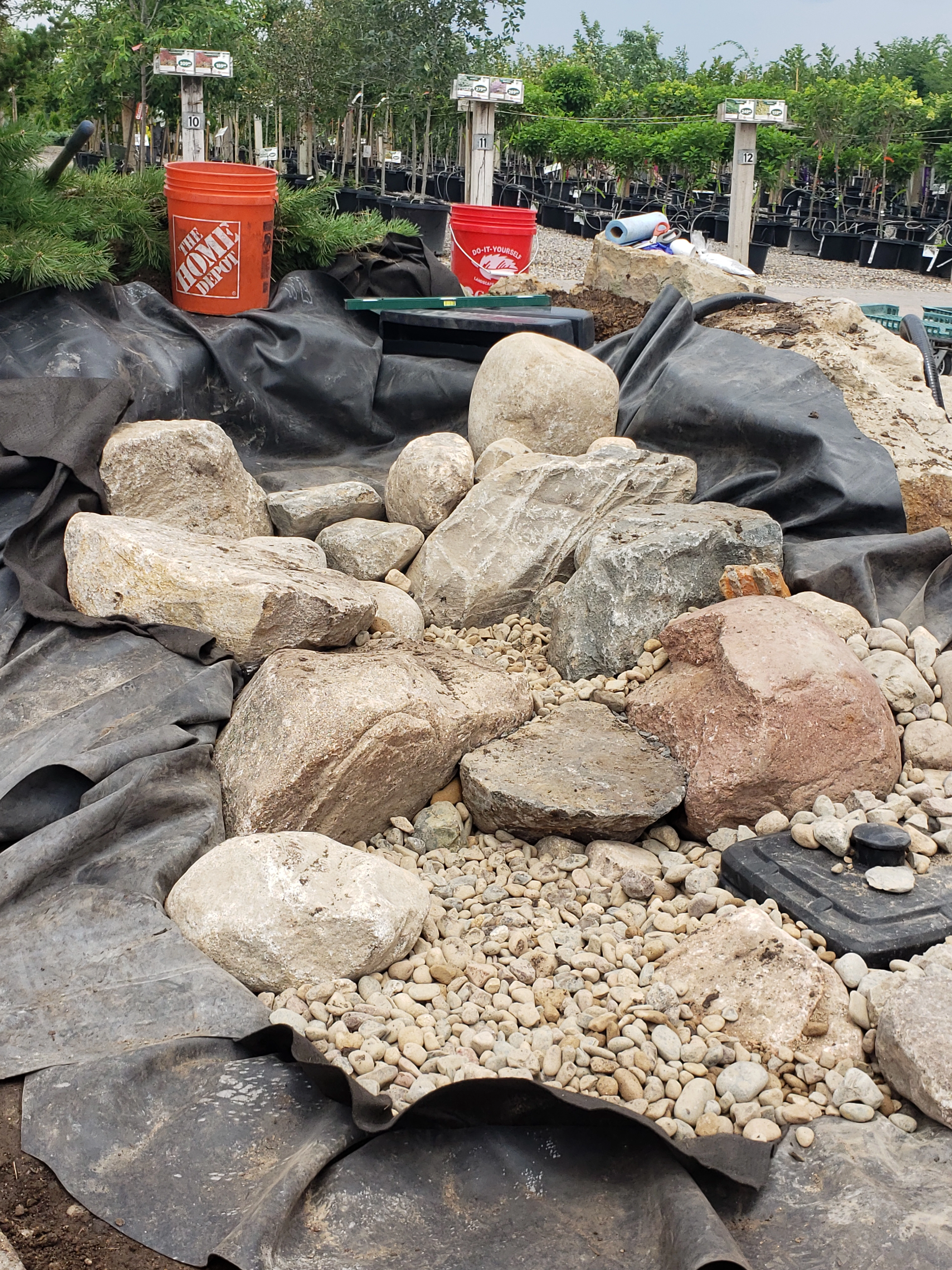 Pondless waterfall boulder placement and gravel detailing
