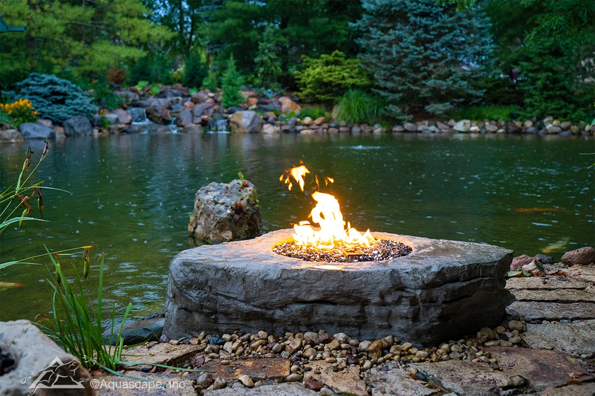 Fire feature near a large ecosystem pond in Inver Grove Heights Minnesota