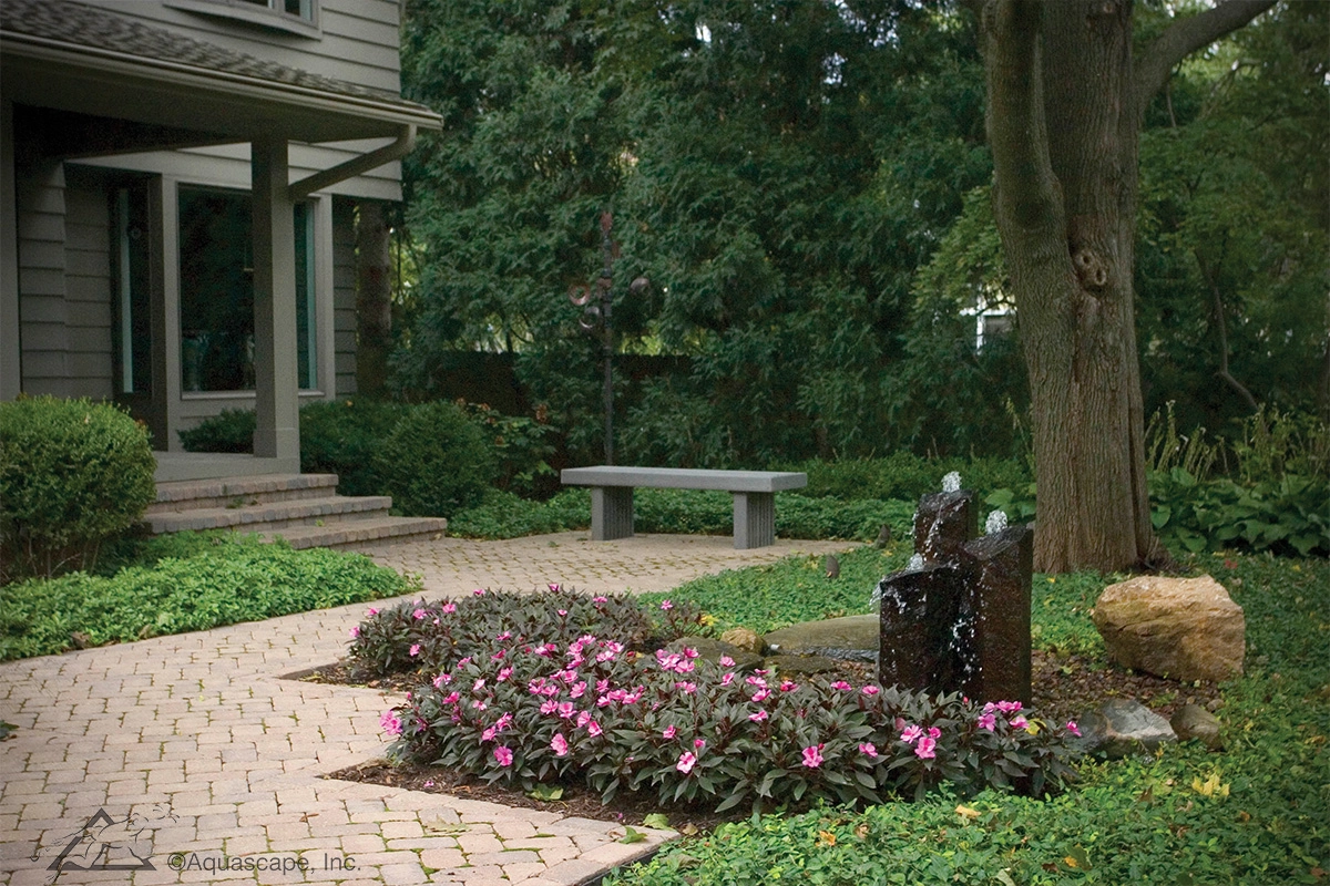 Faux basalt column fountainscape near a front walkway in Marshall Minnesota