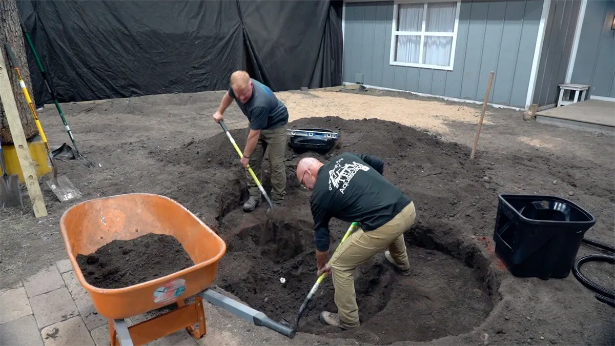 Backyard pond excavation with shelves shaped for an ecosystem pond