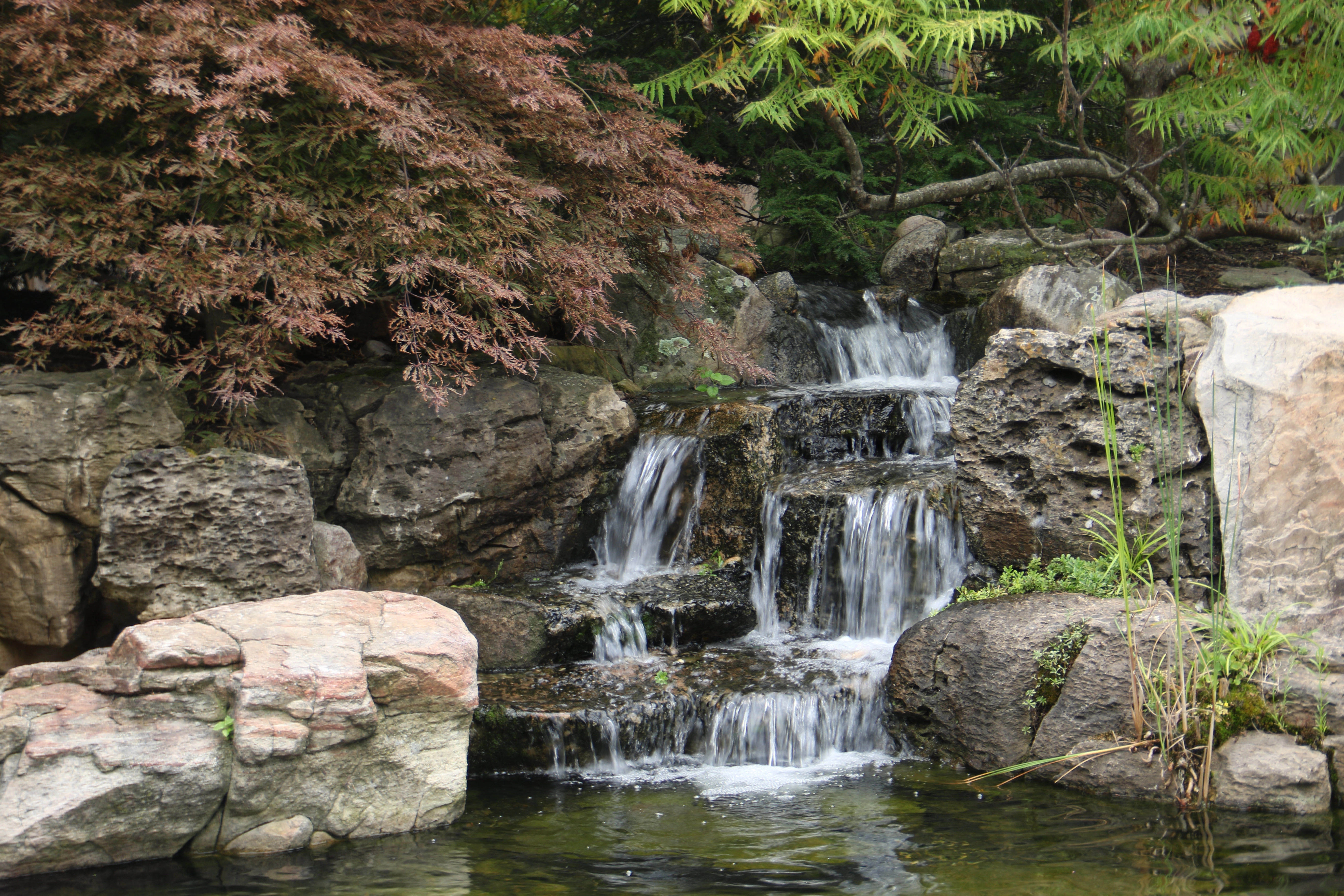 Layered pond waterfall with natural stone in Rosemount Minnesota
