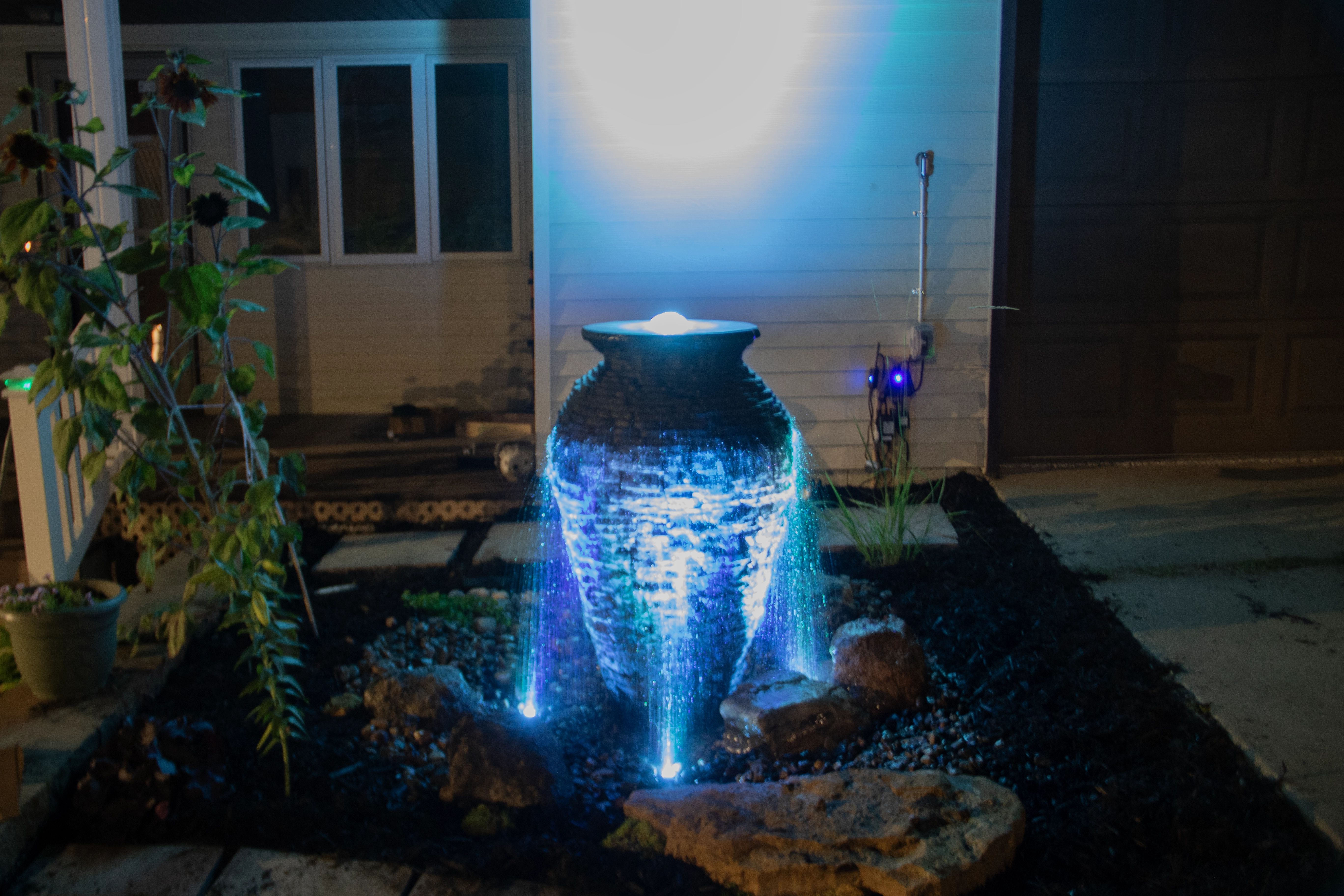 Lit fountainscape water feature in Savage Minnesota
