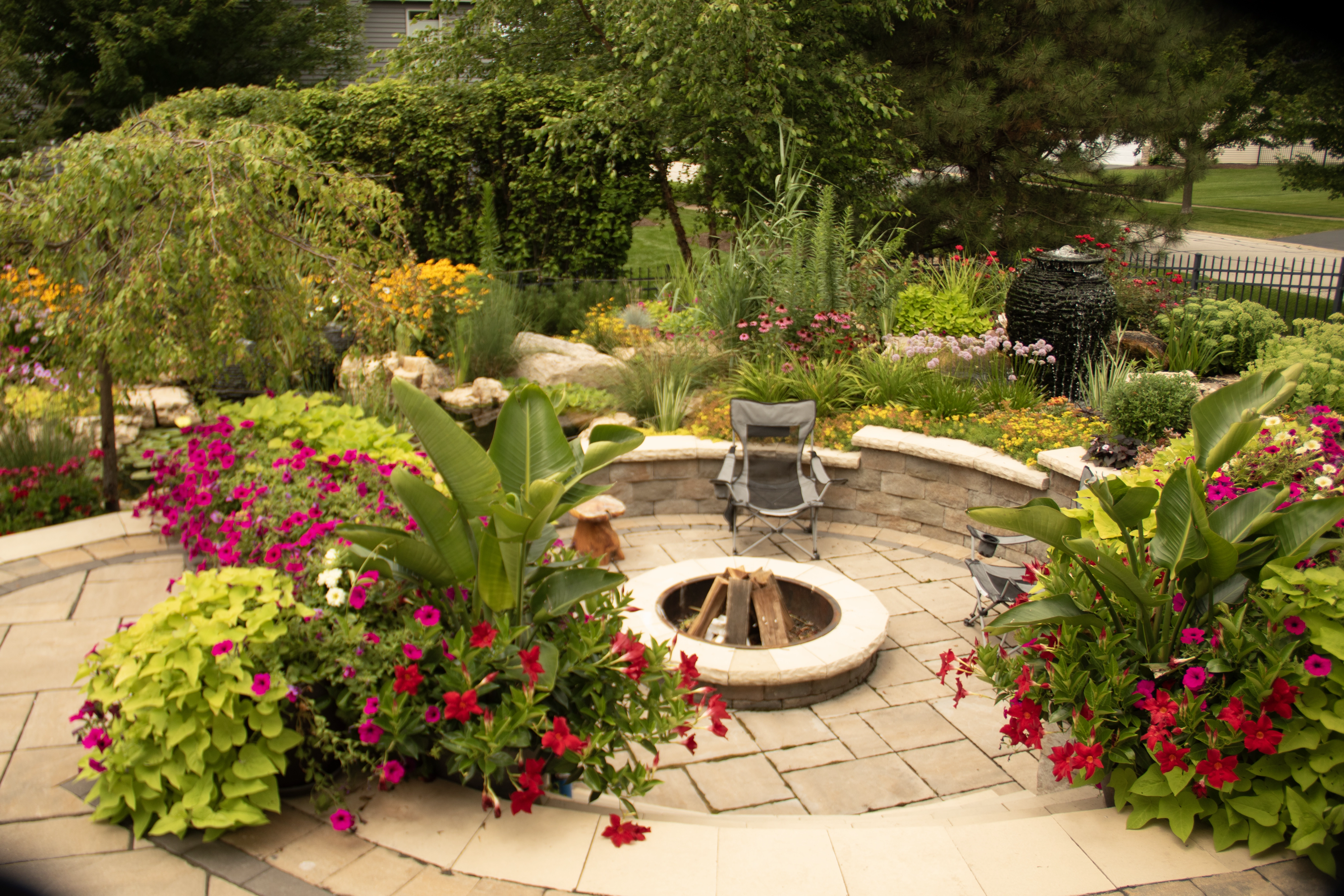 a stacked slate urn as part of a garden landscape