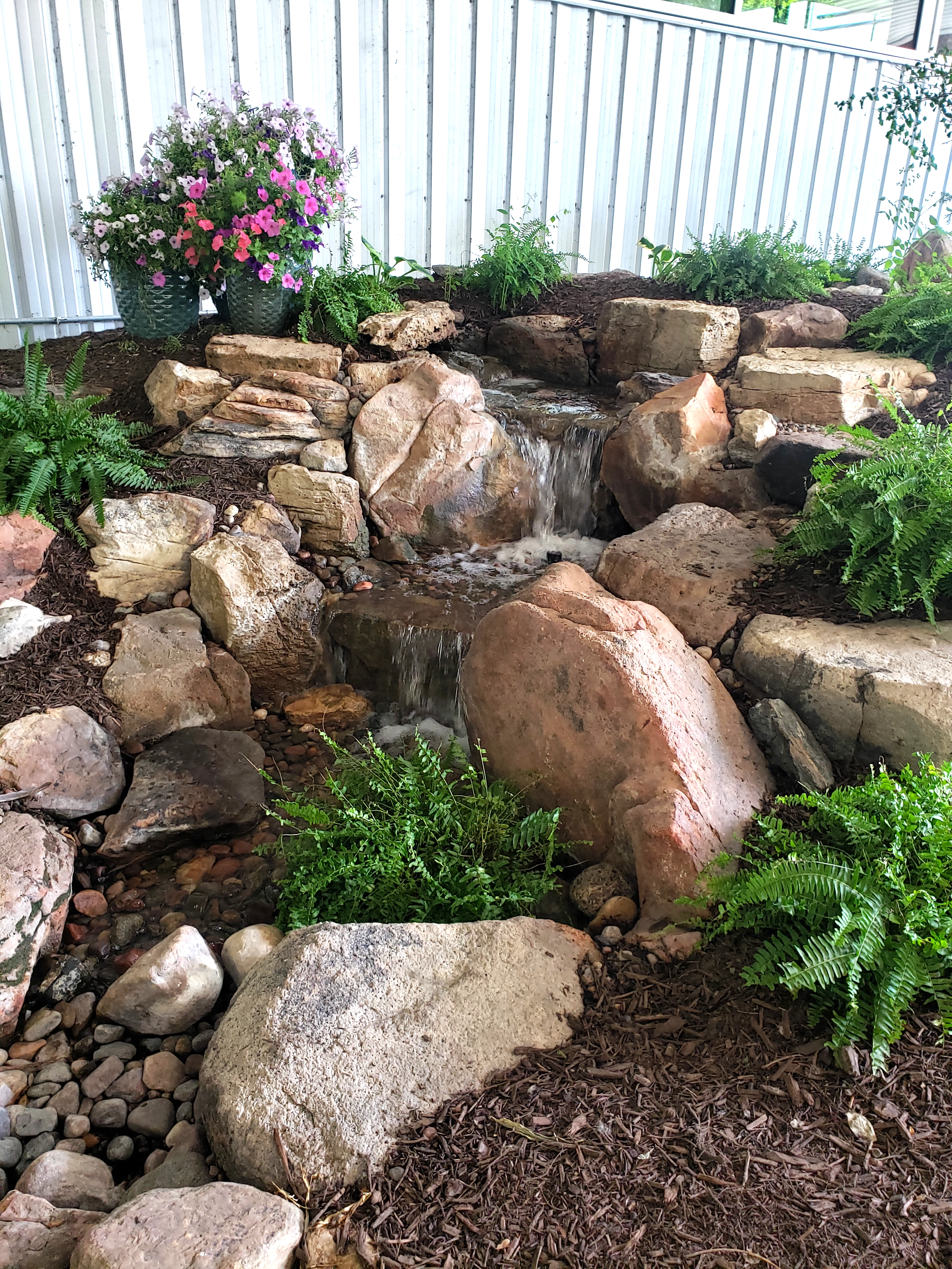 A pondless waterfall near the entry of the Aquascape Pond Shop