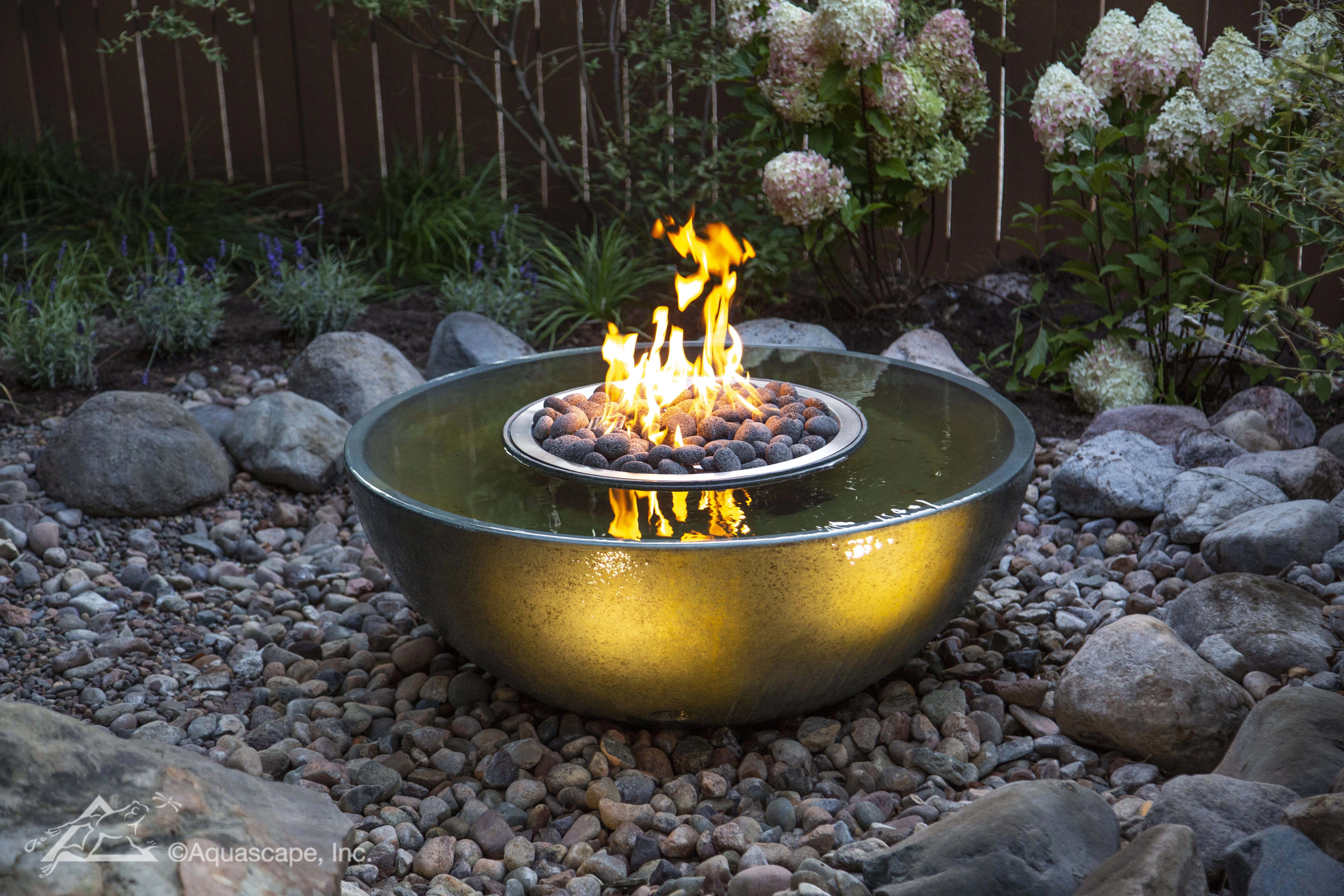 Fire and water spillway basin fountain in a Shakopee backyard landscape