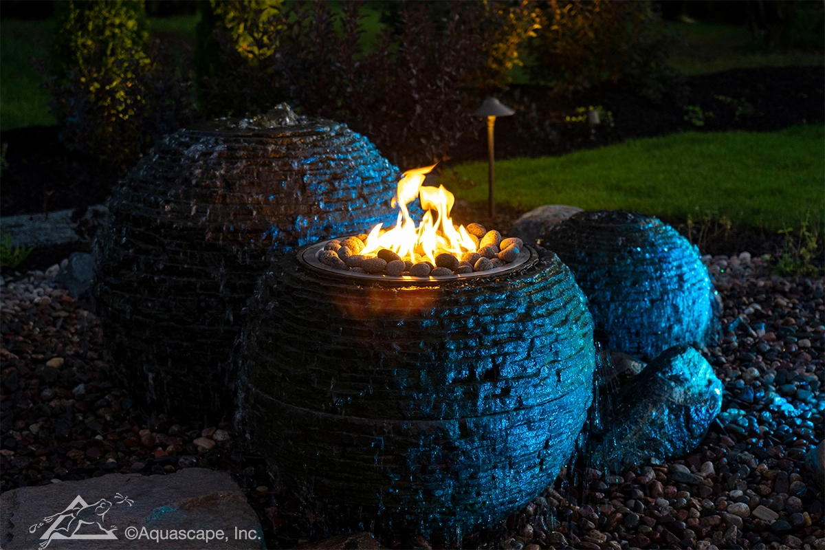 High-end fire and water fountainscape with nighttime lighting